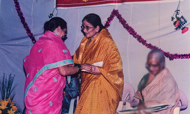 Smt. Sharadamma seen here receiving a small felicitation.